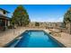 Backyard pool with hot tub and stone surround at 5375 Twilight Way, Parker, CO 80134