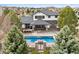 Aerial view showcasing the in-ground pool, patio, and outdoor kitchen area, perfect for entertaining at 5375 Twilight Way, Parker, CO 80134