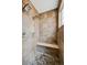 Tile shower with bench and dual shower heads at 5375 Twilight Way, Parker, CO 80134