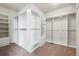 Bright walk-in closet with built-in shelving and drawers at 5375 Twilight Way, Parker, CO 80134