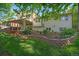 Spacious backyard with covered deck, brick-lined garden, and attractive landscaping, perfect for outdoor entertaining at 8944 W 66Th Pl, Arvada, CO 80004