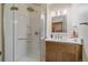 Modern bathroom with a glass-enclosed shower and updated vanity at 8944 W 66Th Pl, Arvada, CO 80004