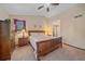 Comfortable bedroom with vaulted ceiling, natural light, and wooden furniture at 8944 W 66Th Pl, Arvada, CO 80004