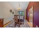 Inviting dining room features a chandelier and natural light from a large window at 8944 W 66Th Pl, Arvada, CO 80004