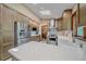 Bright kitchen features stainless steel appliances, quartz countertops, and ample cabinet space at 8944 W 66Th Pl, Arvada, CO 80004