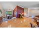 Open-concept living space with hardwood floors, piano, and view to dining room at 8944 W 66Th Pl, Arvada, CO 80004