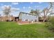 Spacious backyard with green lawn, patio, and a well-maintained lawn at 4634 S Adobe Ct, Littleton, CO 80127