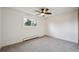 Bright bedroom featuring neutral carpet, a window, and ceiling fan at 4634 S Adobe Ct, Littleton, CO 80127