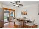 Dining area features hardwood floors, stylish seating, and sliding glass doors to an outdoor patio, great for entertaining at 4634 S Adobe Ct, Littleton, CO 80127