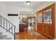 Inviting entryway featuring hardwood floors, stairs to upper level, and double-door access to outdoor patio at 4634 S Adobe Ct, Littleton, CO 80127