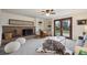 Cozy living room with a brick fireplace, built-in shelving, and access to the backyard, perfect for relaxing indoors at 4634 S Adobe Ct, Littleton, CO 80127