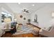 Open living room with hardwood floors, contemporary furnishings, and an inviting atmosphere, ideal for gatherings at 4634 S Adobe Ct, Littleton, CO 80127