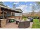 Outdoor patio with furniture, a fire pit, and grill for entertaining at 4634 S Adobe Ct, Littleton, CO 80127