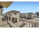 Exterior view from the second story balcony overlooking neighborhood homes at 5035 N Walden Way, Denver, CO 80249