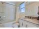 Clean bathroom with tub and shower combination and granite vanity at 5035 N Walden Way, Denver, CO 80249