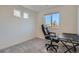 Bright bedroom with neutral carpet and a modern desk and chair at 5035 N Walden Way, Denver, CO 80249
