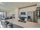 Bright kitchen featuring an island with sink, stainless steel appliances, and modern cabinets at 5035 N Walden Way, Denver, CO 80249