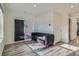 Spacious living room with wood floors, and sliding door for ample natural light at 5035 N Walden Way, Denver, CO 80249