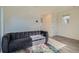 Cozy living room with a comfortable sofa, plush rug, and bright natural light at 5035 N Walden Way, Denver, CO 80249