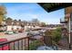 Enjoy the outdoors on the balcony, overlooking the parking area and building exterior at 7755 E Quincy # 201, Denver, CO 80237