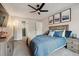 Charming bedroom featuring calming decor, a ceiling fan, and plenty of closet space at 7755 E Quincy # 201, Denver, CO 80237