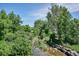 Water feature at Rosamond Park, a nearby park, surrounded by lush green landscaping and trees at 7755 E Quincy # 201, Denver, CO 80237