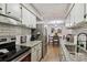 Modern kitchen with stainless steel appliances and a clear view to the dining area at 7755 E Quincy # 201, Denver, CO 80237