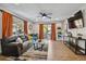 Open living room with wood floors, comfortable seating, and access to a private balcony at 7755 E Quincy # 201, Denver, CO 80237