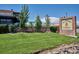 Green space at La Fogata Mexican Restaurant with colorful umbrellas and a brick exterior at 7755 E Quincy # 201, Denver, CO 80237