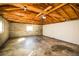 Unfinished basement featuring concrete floors, exposed beams, and natural light at 4933 W 61St Ave, Arvada, CO 80003