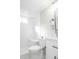 Bright bathroom with white subway tile shower with bench and modern fixtures at 4933 W 61St Ave, Arvada, CO 80003
