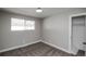 Neutral bedroom with plush carpet, a window bringing in natural light, and a convenient closet at 4933 W 61St Ave, Arvada, CO 80003