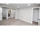Spacious bedroom with neutral carpeting and trim, leading to ensuite bathroom at 4933 W 61St Ave, Arvada, CO 80003