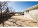 Long concrete driveway leading to the detached garage and backyard at 4933 W 61St Ave, Arvada, CO 80003