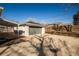 Detached garage and carport accessible via a long driveway at 4933 W 61St Ave, Arvada, CO 80003