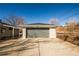 Detached garage with modern gray door and plenty of room for parking at 4933 W 61St Ave, Arvada, CO 80003