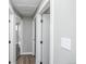 Bright hallway with fresh paint, new flooring, and white trim on doors and baseboards at 4933 W 61St Ave, Arvada, CO 80003