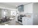 Bright, updated kitchen seamlessly connects to the dining and living areas, perfect for modern living at 4933 W 61St Ave, Arvada, CO 80003