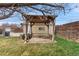A relaxing backyard with a shaded pergola, providing a perfect spot for outdoor entertaining and relaxation at 3021 Locust St, Denver, CO 80207