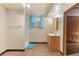 Basement bathroom with linoleum floor, walk-in shower, vanity and medicine cabinet at 3021 Locust St, Denver, CO 80207