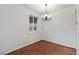 Cozy dining room features neutral walls, carpet, light fixture and a window at 3021 Locust St, Denver, CO 80207