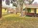 Spacious yard featuring a chain-link fence, mature trees, and an inviting outdoor space at 3021 Locust St, Denver, CO 80207