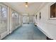 Enclosed sunroom with lots of windows that creates a bright and relaxing space at 3021 Locust St, Denver, CO 80207