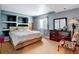 Basement bedroom with dresser and sitting chair at 5799 S Depew Cir, Littleton, CO 80123