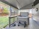 Backyard featuring covered hot tub with privacy screen, a small deck, and a grass area at 11569 Grape St, Thornton, CO 80233