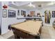 Basement with billiard table, ceiling lighting, wall decor, and a rack for billiards equipment at 11569 Grape St, Thornton, CO 80233
