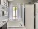 Bright bathroom with soaking tub and shower at 11569 Grape St, Thornton, CO 80233