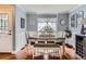 Bright dining area featuring hardwood floors, natural light, and a stylish table setting for Gathering meals at 11569 Grape St, Thornton, CO 80233