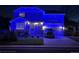 Two-story home adorned with blue lights creating a festive and inviting ambiance at 11569 Grape St, Thornton, CO 80233