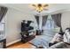 Inviting living room with hardwood floors, large windows, and comfortable seating at 11569 Grape St, Thornton, CO 80233